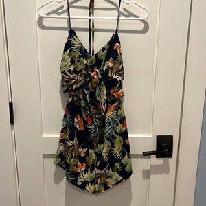 Darling tie in the front romper. Navy, floral open midriff